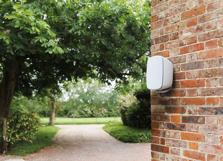 Monitor Audio Climate Series 3G outdorr speakers shown on a building