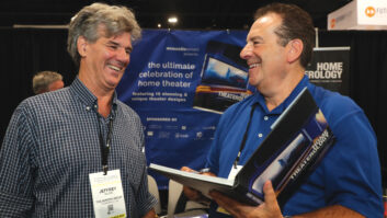 Richard Charschan (right) signs his new book, Home Theaterology, for CEDIA attendee Jeffrey Allen.