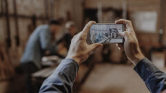 Person taking a cellphone video on a a job site